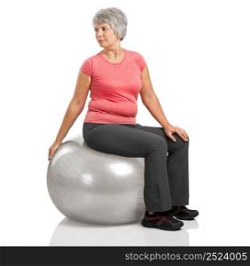 Happy fitness old woman making exercises with a PIlates ball