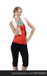 happy fitness woman with a bottle of blue water. happy beautiful fitness woman with a bottle of blue water on white background