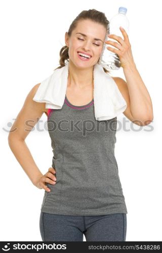 Happy fitness young woman enjoying bottle of water