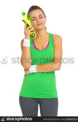 Happy fitness young woman enjoying cold bottle of water