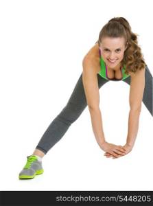 Happy fitness young woman stretching