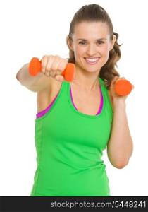 Happy fitness young woman workout with dumbbells