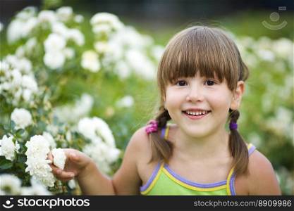 Happy five years Girl smiling outdoors headshot. Girl smiling outdoors
