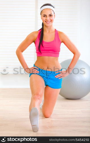 Happy flexible pretty girl making gymnastics exercise&#xA;