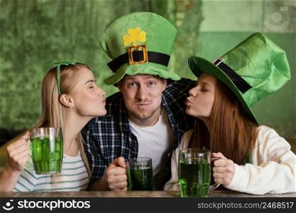 happy friends celebrating together st patrick s day bar with drinks