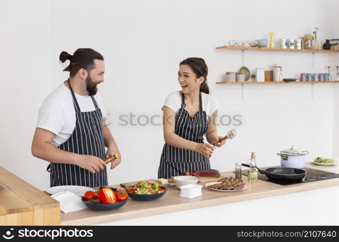 happy friends cooking together