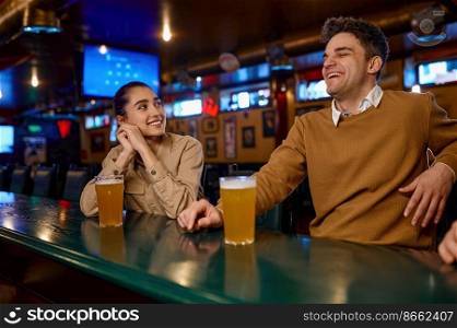 Happy friends drinking beer in pub enjoy nice conversation. Weekend time and hobby vacation. Happy friends drinking beer in pub enjoy nice conversation
