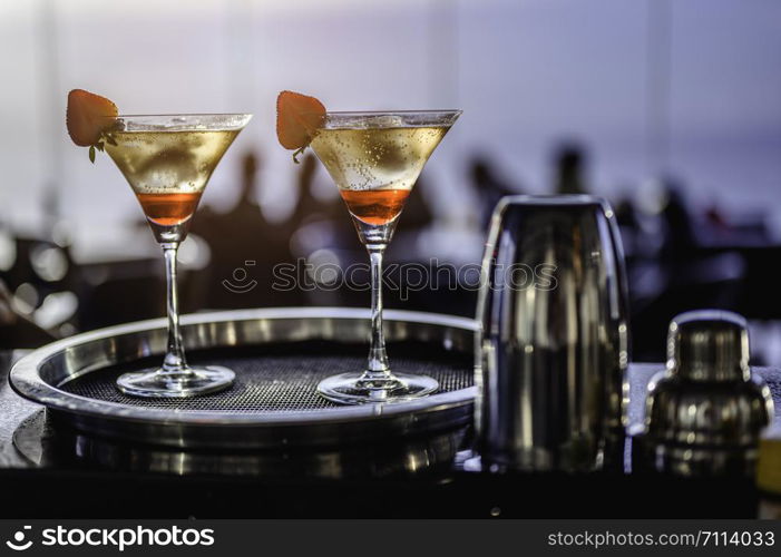 Happy friends drinking cocktails in sky bar.