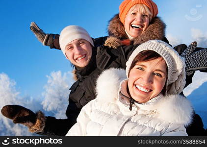 Happy friends on a winter background