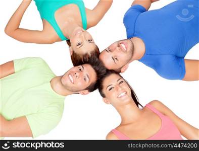 Happy friends on the floor with their heads together isolated on white background