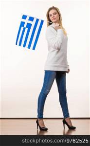 Happy funny woman holding Greece greek national flag being patriotic loving her country.. Happy woman holding Greek national flag