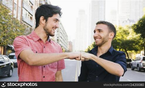 happy gay couple greeting street