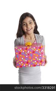 Happy girl carrying a gift
