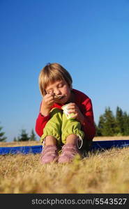 happy girl eating healthy food in nature