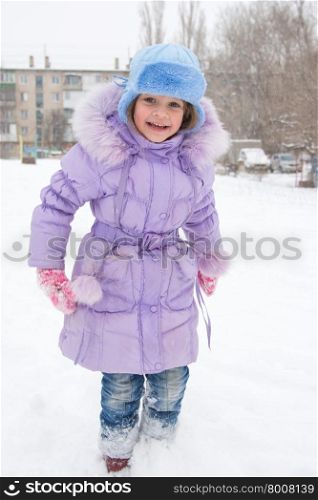 Happy girl enjoys snow. Happy five year old girl is happy snowy weather