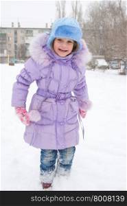Happy girl enjoys snow. Happy five year old girl is happy snowy weather