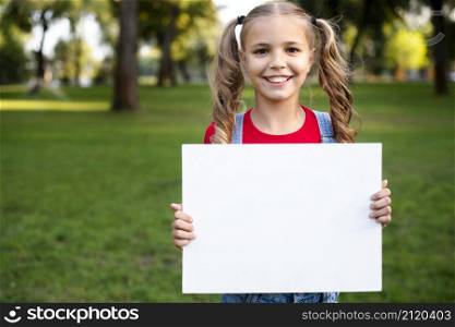happy girl holding empty banner her hand