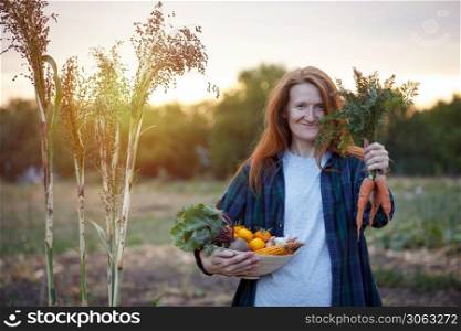 happy girl holds bowl of vegetables from your garden