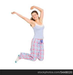 Happy girl in pajamas jumping