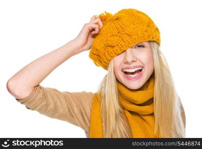 Happy girl in scarf and hat having fun