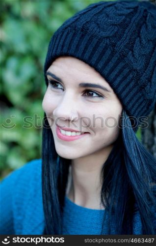 Happy girl in the park with wool cap