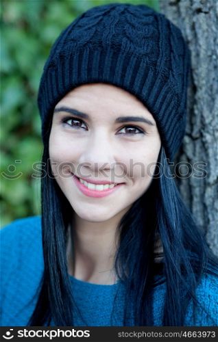 Happy girl in the park with wool cap