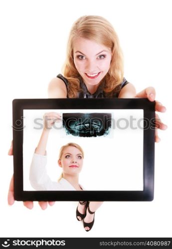 Happy girl medicine student showing ipad with photo of doctor with x-ray. Modern young woman holding tablet touchpad dreaming about be a physician. Isolated. Technology and medical health care.