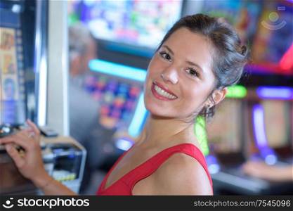 happy girl playing slot machines in las vegas