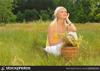Happy girl relaxing on a meadow
