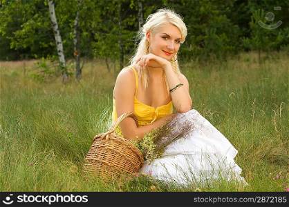 Happy girl relaxing on a meadow