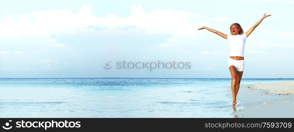 happy girl run along the ocean coast. happy tropical girl run