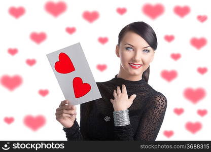 happy girl takes the valentine postcard and smiles