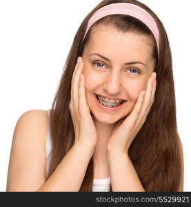 Happy girl with braces teenage beauty on white background