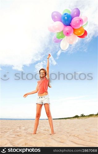 Happy girl with colorful balloons