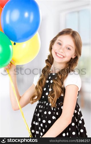 happy girl with colorful balloons at home