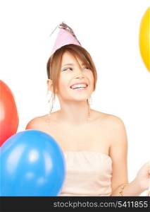 happy girl with colorful balloons in party cap