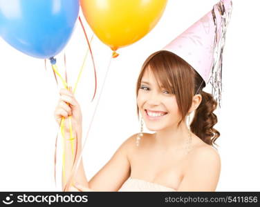 happy girl with colorful balloons in party cap