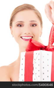 happy girl with gift box over white