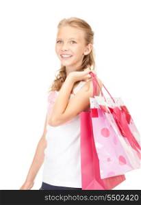 happy girl with shopping bags over white&#xA;
