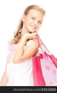 happy girl with shopping bags over white&#xA;