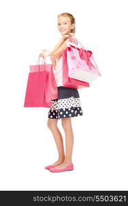 happy girl with shopping bags over white&#xA;