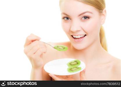 Happy girl young smiling woman eating slices of kiwi tropical fruit isolated on white. Healthy diet and nutrition. Studio shot.
