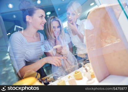 happy girls group have fun while shopping in jewelry store