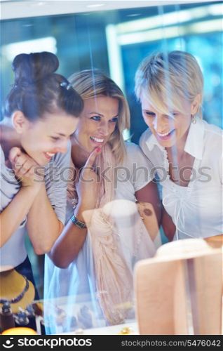 happy girls group have fun while shopping in jewelry store