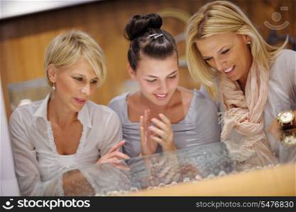 happy girls group have fun while shopping in jewelry store