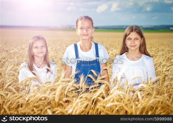 Happy girls meadow weat field