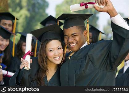 Happy Graduates with Diplomas