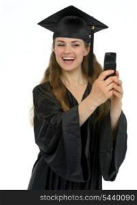 Happy graduation girl making self photo by phone