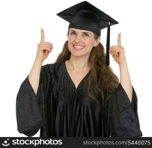 Happy graduation student girl pointing up