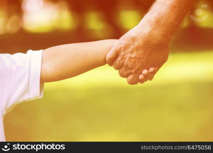 happy grandfather and child have fun and play in park on beautiful sunny day. grandfather and child have fun in park